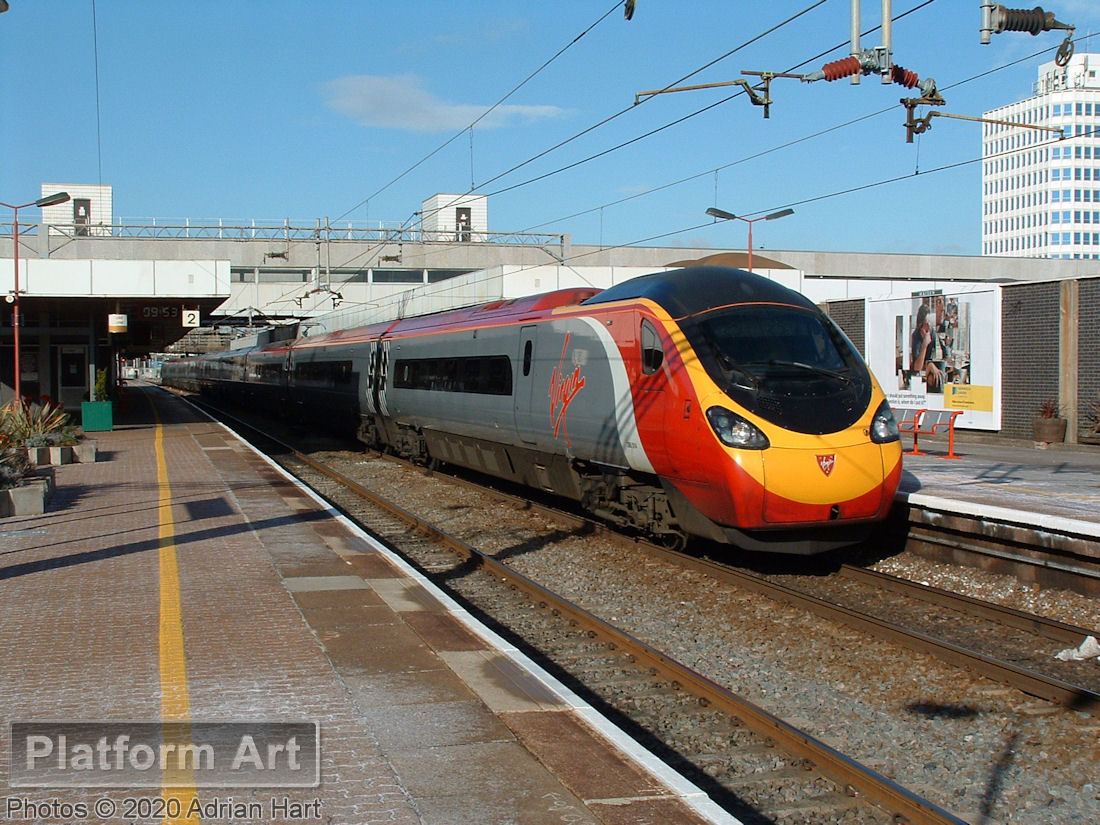 A Class 390 Virgin Pendolino waits in Platform 1 at Coventry on 2nd March 2006, with a service from either Wolverhampton or Birmingham New Street to London Euston.