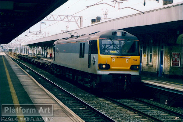 Class 92 92004 Jane Austen powers a southbound freight along the up main line through Nuneaton station on 13th March 2003.