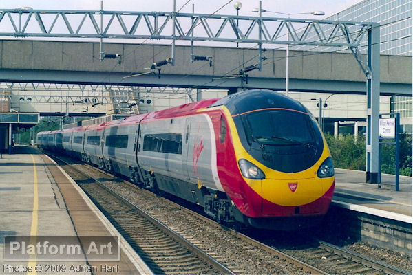 Virgin Pendolino 390039 Virgin Quest passes Milton Keynes Central on 14th April 2004 with a southbound empty coaching stock movement.