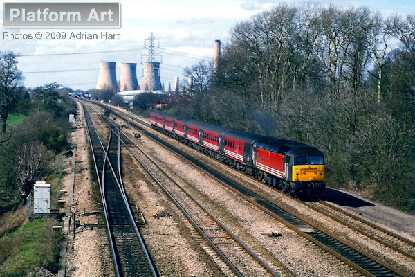 With Didcot Power Station dominating the background, Class 47 47807 The Lion of Vienna traverses the Great Western Main Line between Didcot and South Moreton on 26th March 1999 with a Virgin Cross Country service bound for the South Coast.