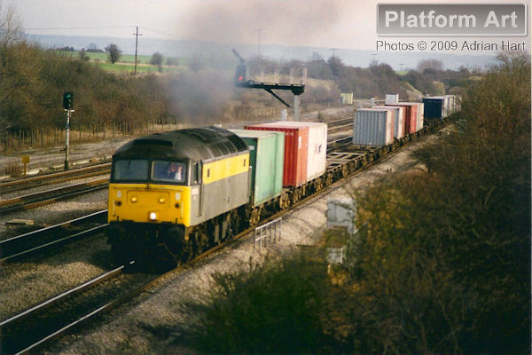 Departmental liveried Class 47 47353 is captured between South Moreton and Didcot on 3rd February 1998 with the 4E74 12.25 Southampton Maritime - Leeds freightliner service.
