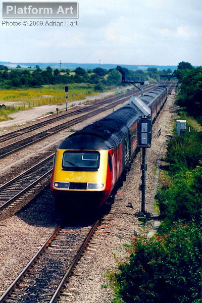 Virgin Cross Country HST power car 43099 leads a northbound service approaching Didcot on 6th July 2002.